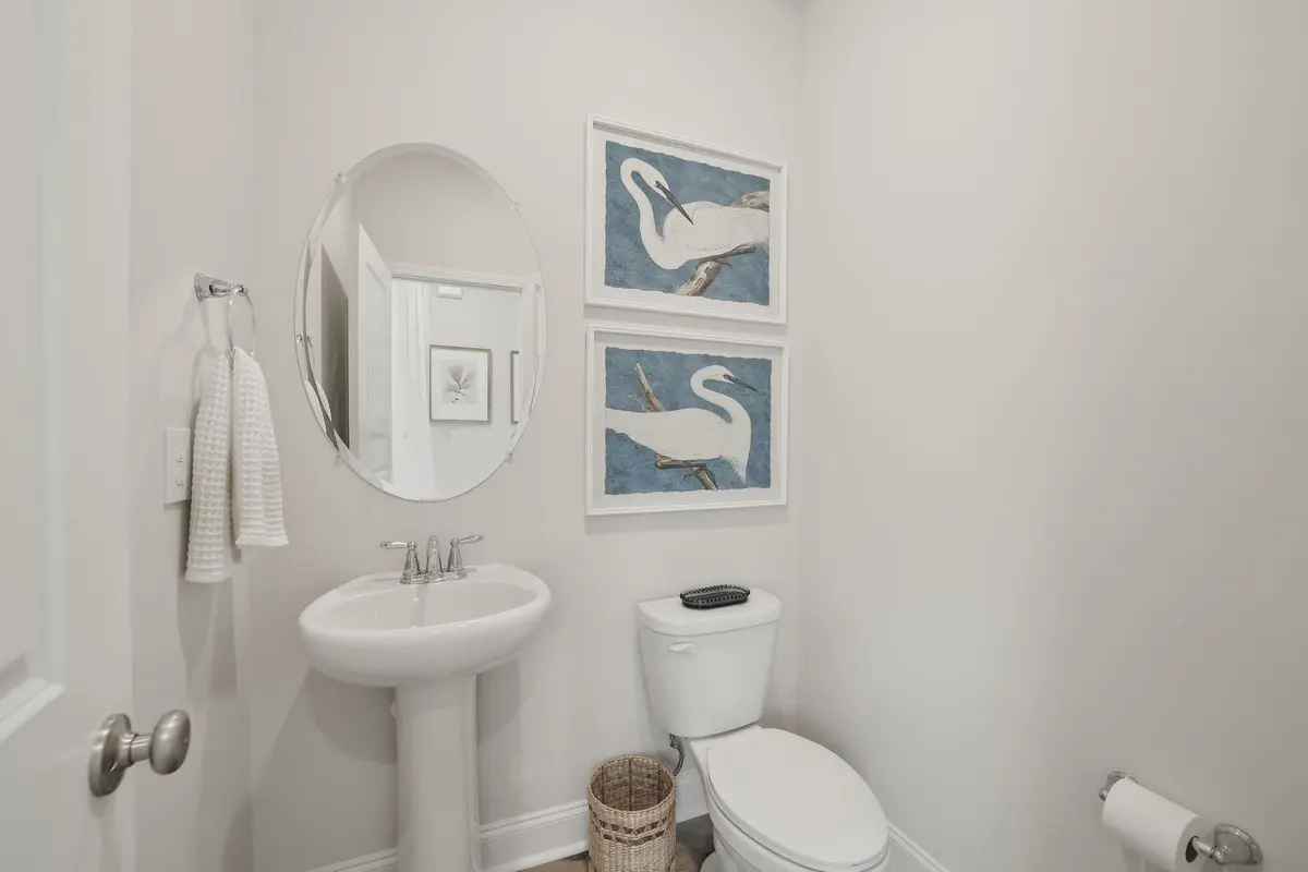 Powder room with coastal egret artwork
