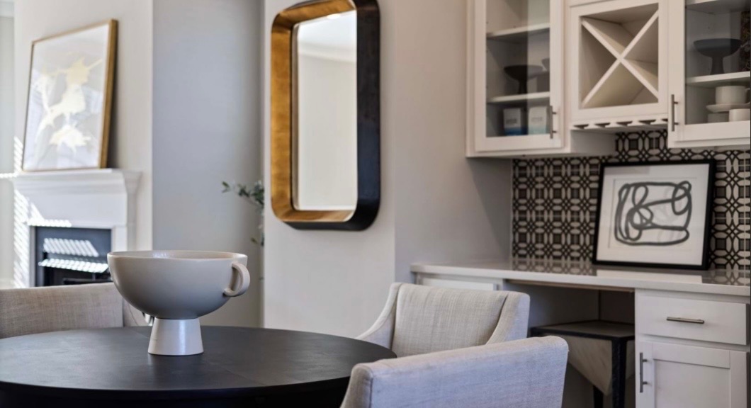 Dining area with fireplace and patterned wet bar