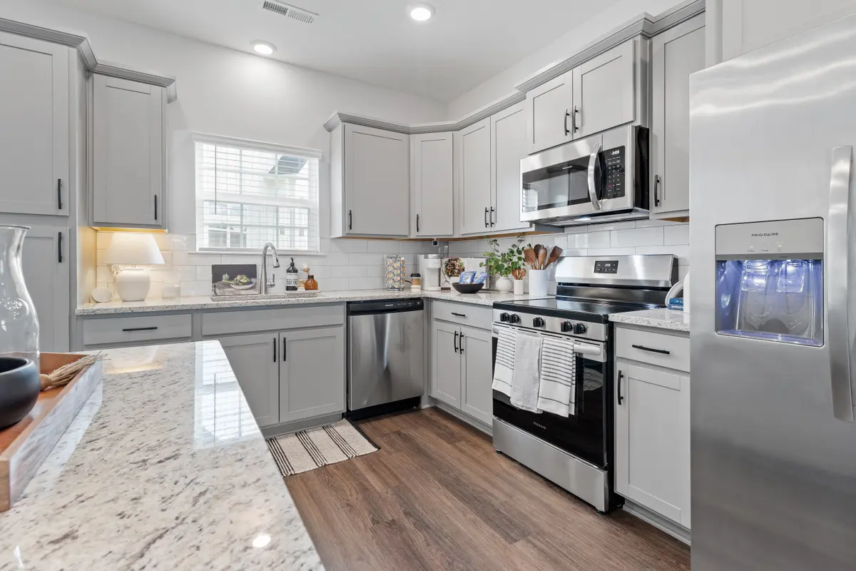 Gray shaker kitchen with subway tile backsplash