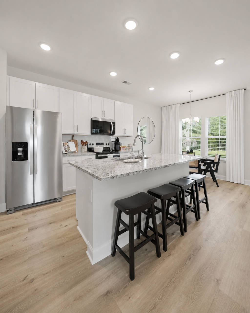 White kitchen with granite island