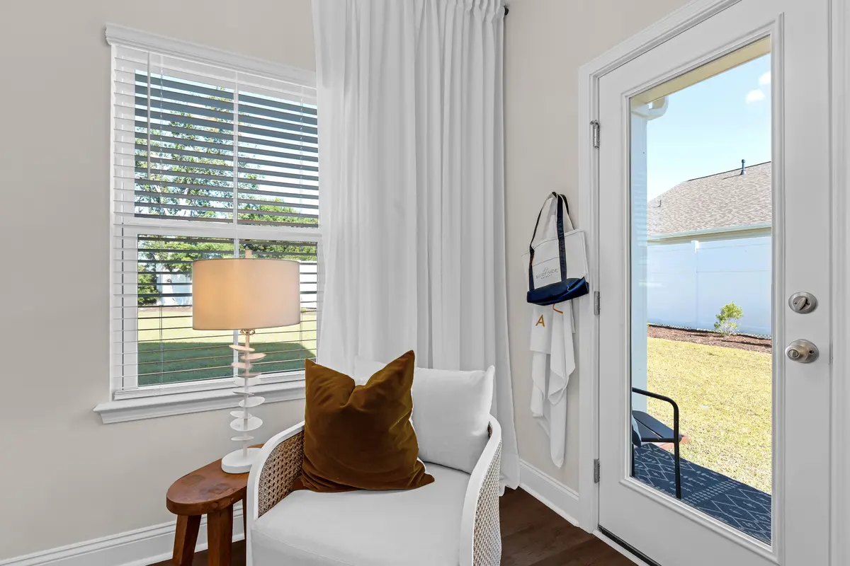 Cozy reading nook with accent chair and garden view